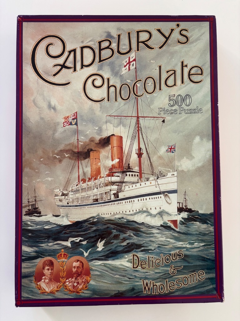 Vintage illustration of a steamship at sea with portraits of a king and queen below.