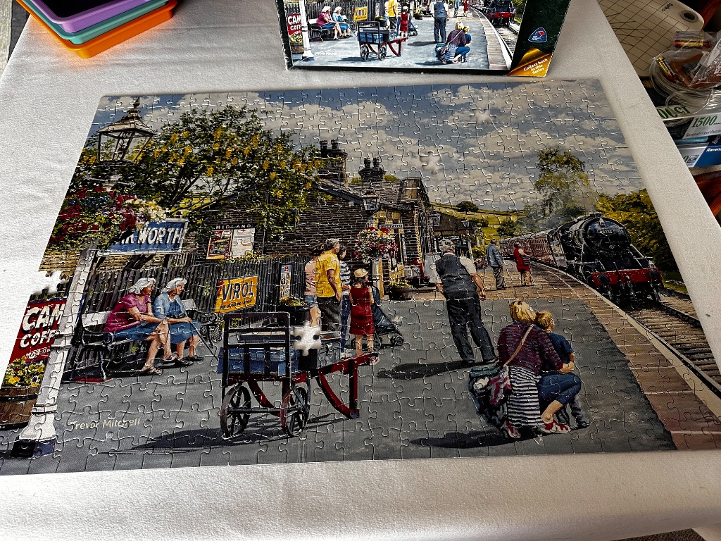 A nostalgic painting of a bustling 1950s British railway station with a steam locomotive arriving.