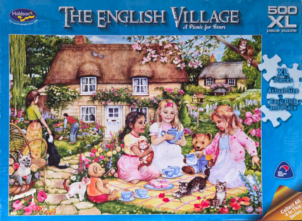A peaceful English cottage garden scene with children having a tea party with teddy bears and kittens.