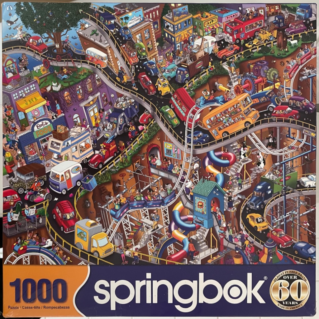 A whimsical, densely detailed illustration of a multi-level city with winding roads and rollercoaster tracks.