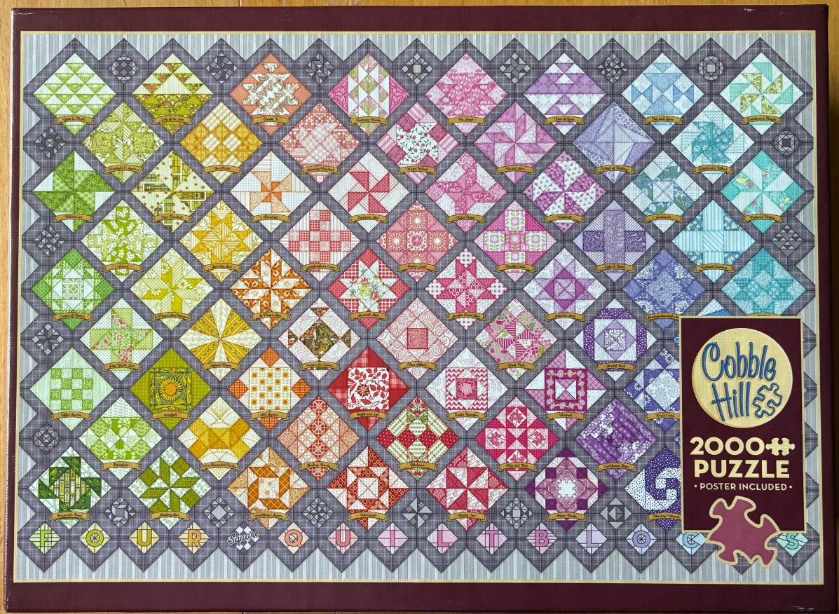 A colorful collection of assorted quilt block patterns arranged in a diagonal grid against a grey background.