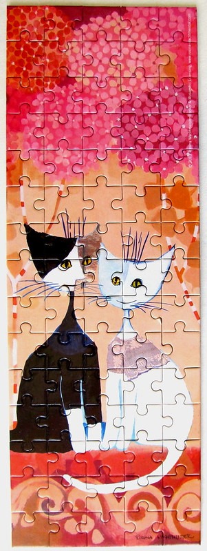 Stylized illustration of two cats against a pink and orange floral background.