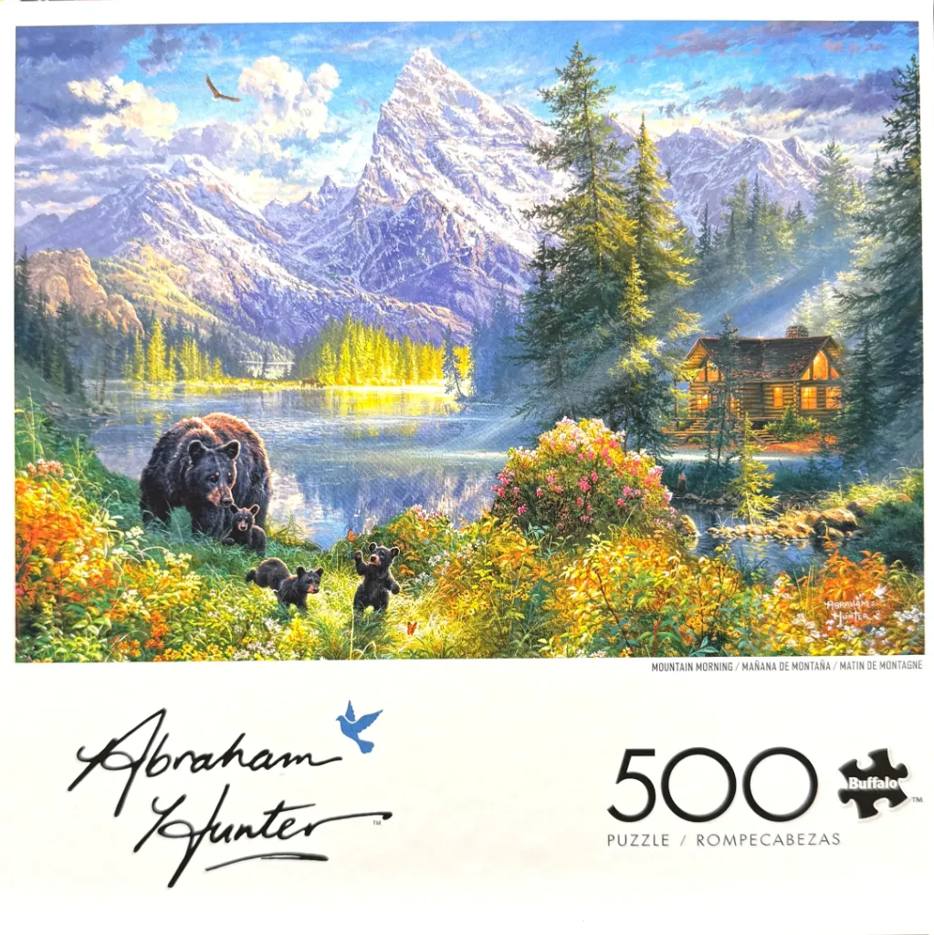 Painting of a mother bear and her cubs in a vibrant mountain lake scene with a log cabin.