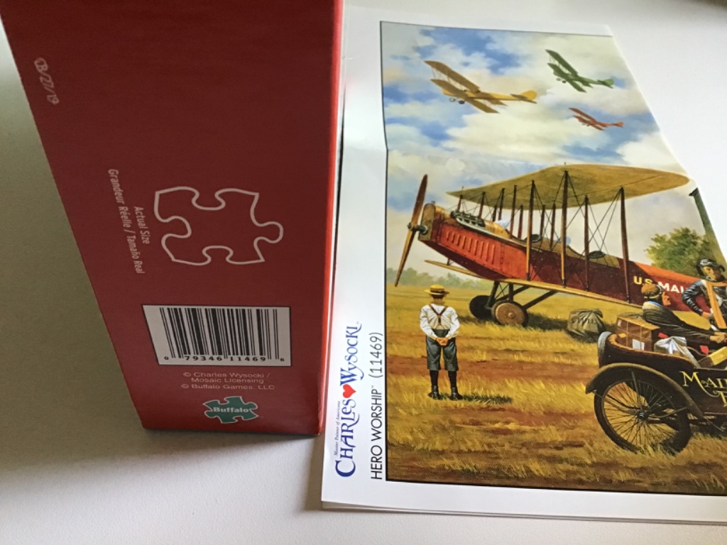 A nostalgic Americana illustration of an early biplane on an airfield with a boy watching and other planes flying above.
