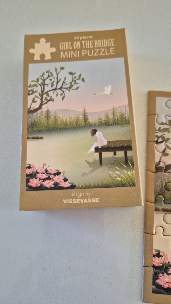 A digital illustration of a woman in a white dress sitting on a wooden bridge by a serene lake at twilight.