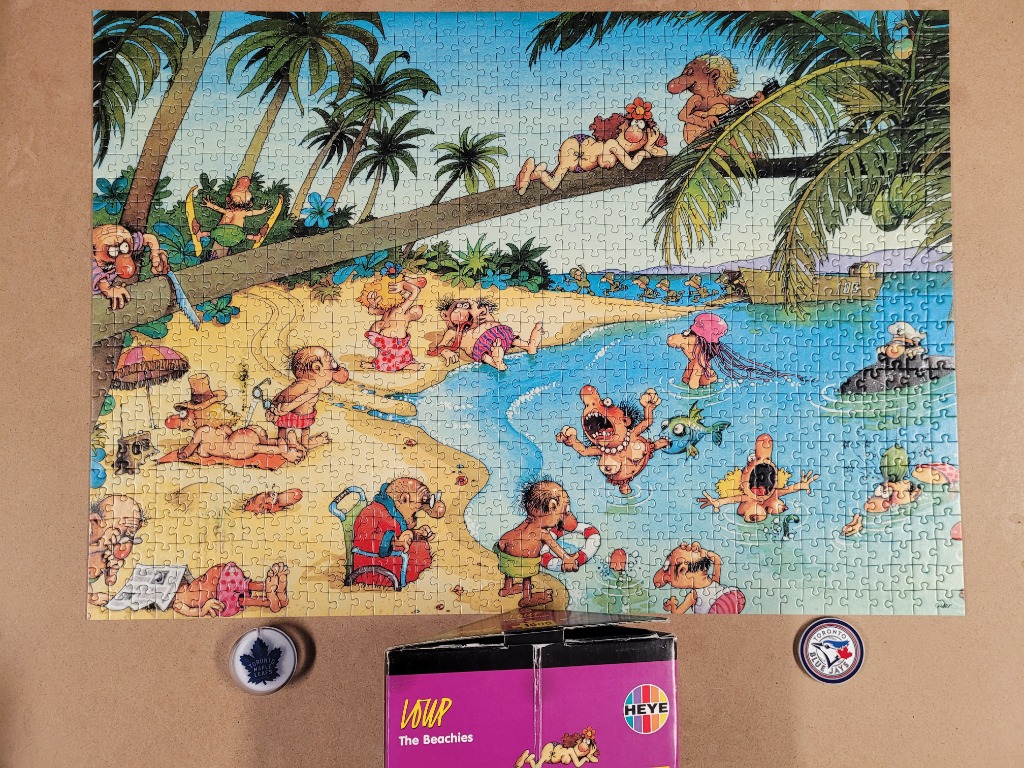 Funny cartoon beach scene with people swimming, sunbathing, and relaxing under palm trees.