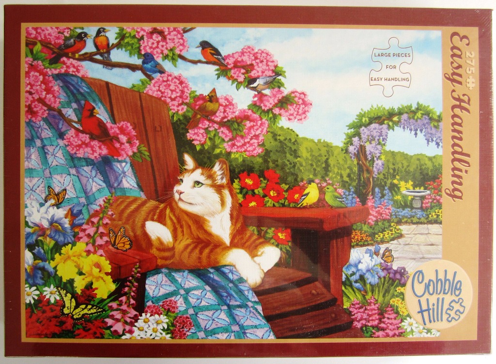 An orange and white cat resting on a wooden garden chair surrounded by flowers, butterflies, and colorful songbirds.