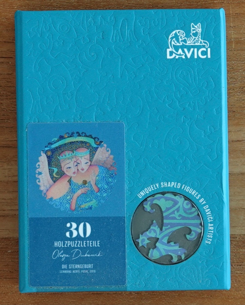 Illustration of two winged, crowned figures within a circular border on a textured turquoise background.