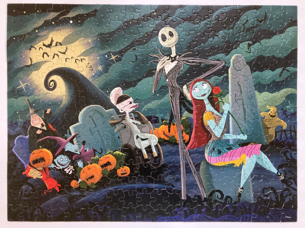 Jack Skellington and Sally in a graveyard scene with other characters from The Nightmare Before Christmas