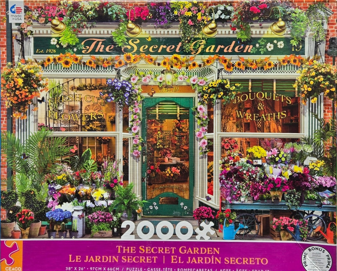 A charming, flower-filled florist shop facade labeled The Secret Garden.