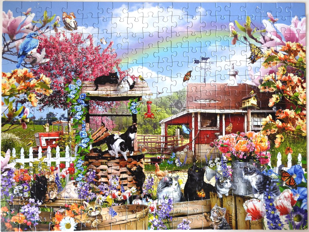 A vibrant country farm scene filled with cats, flowers, a red barn, and a rainbow.
