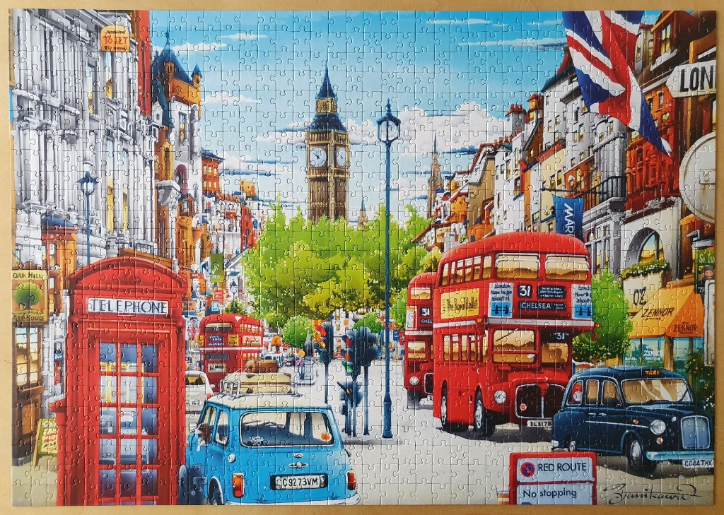 A lively street scene in London with a red telephone box, double-decker bus, black taxi, and Big Ben in the background.