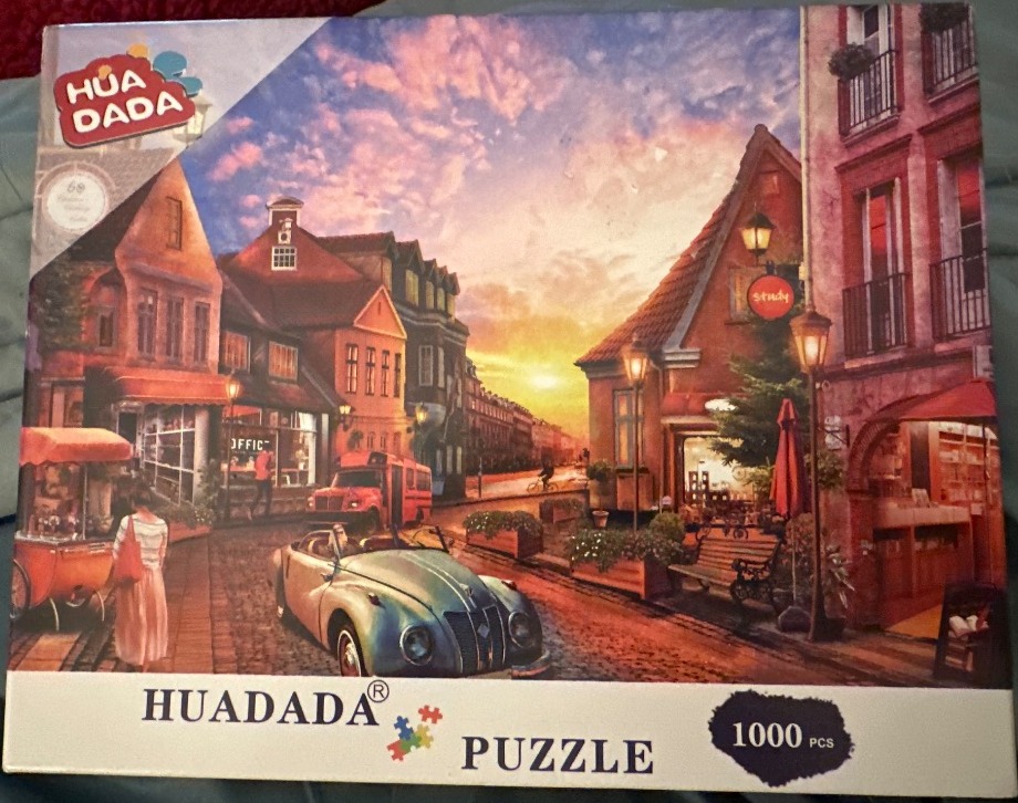 A European-style street scene at sunset featuring classic buildings, a vintage car, and warm atmospheric lighting.