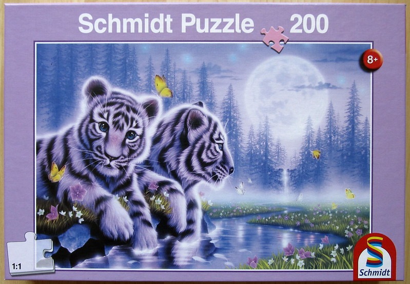 Two white tiger cubs resting by a stream under a full moon in a fantasy forest scene.
