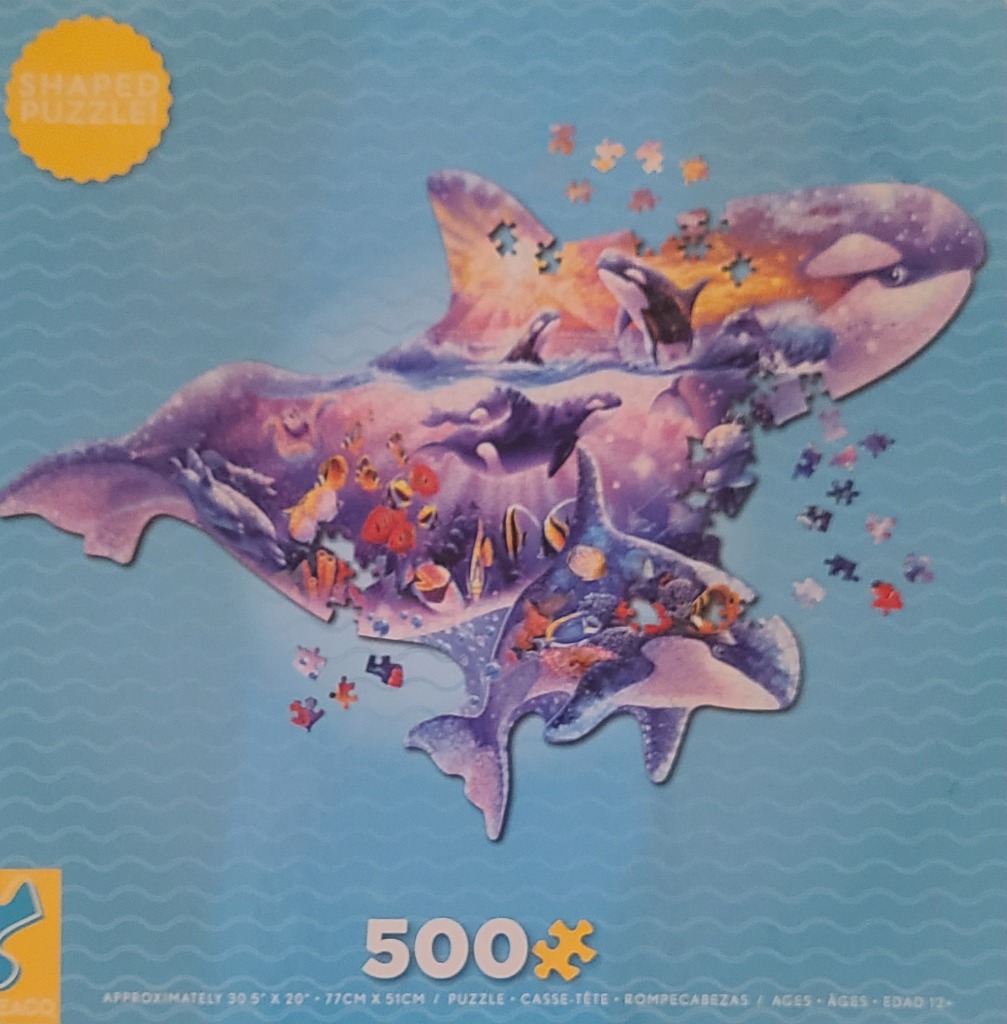 A double-exposure illustration of an orca silhouette filled with a sunset ocean scene featuring marine life.
