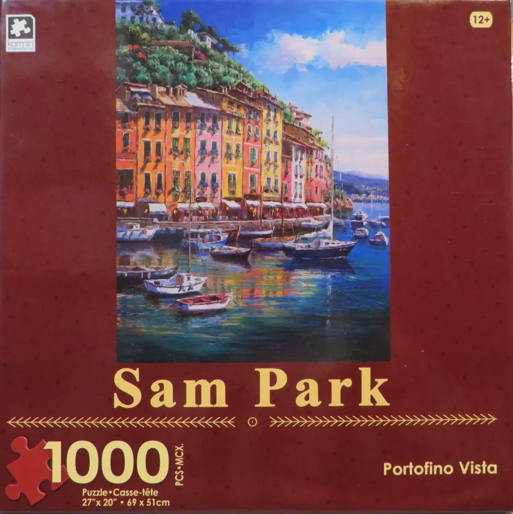 Oil painting of the coastal village of Portofino with colorful buildings, a harbor full of boats, and a blue sky.