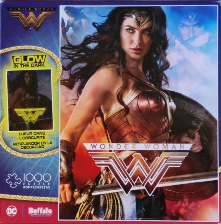 Wonder Woman in golden armor with a sword and shield, set against a fiery, cinematic background.
