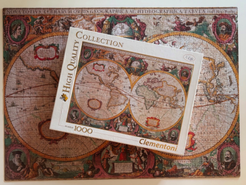 Antique world map illustration with two circular hemispheres and decorative borders