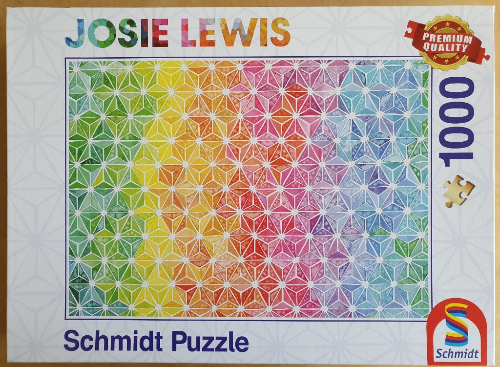 Abstract geometric pattern of triangles in a spectrum of watercolor colors