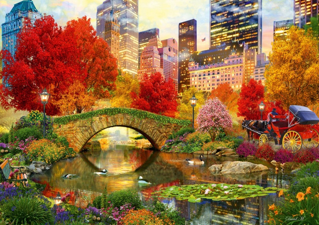 A horse-drawn carriage crosses a stone bridge in a vibrant autumn park with a city skyline in the background.