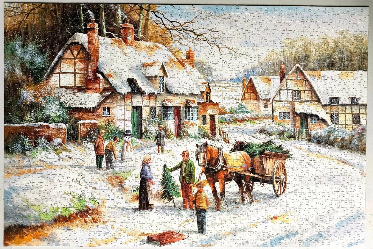A nostalgic winter village scene featuring timber-framed cottages, a horse-drawn cart, and people in period clothing.