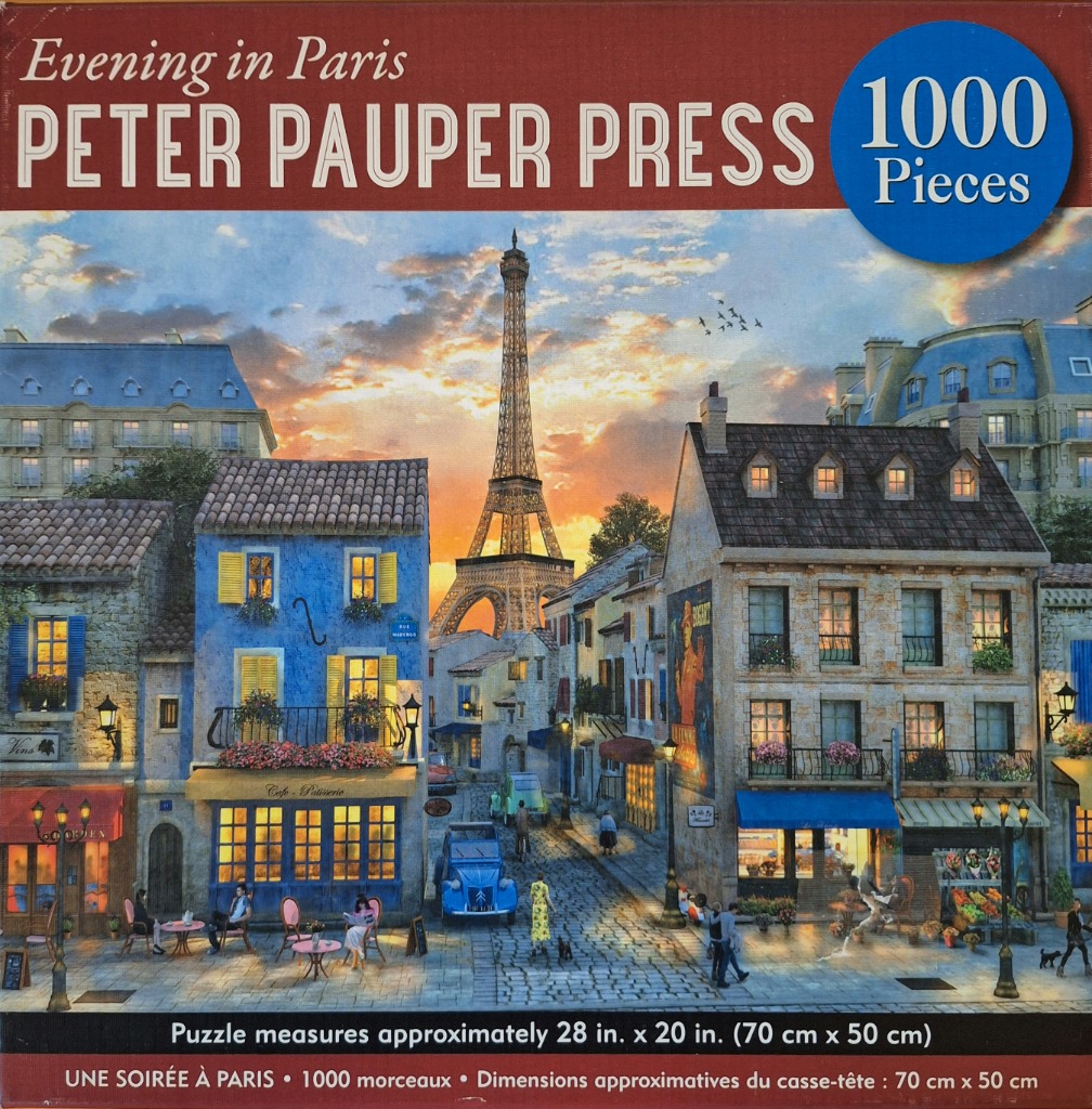 A charming Parisian street scene at sunset with the Eiffel Tower in the distance.