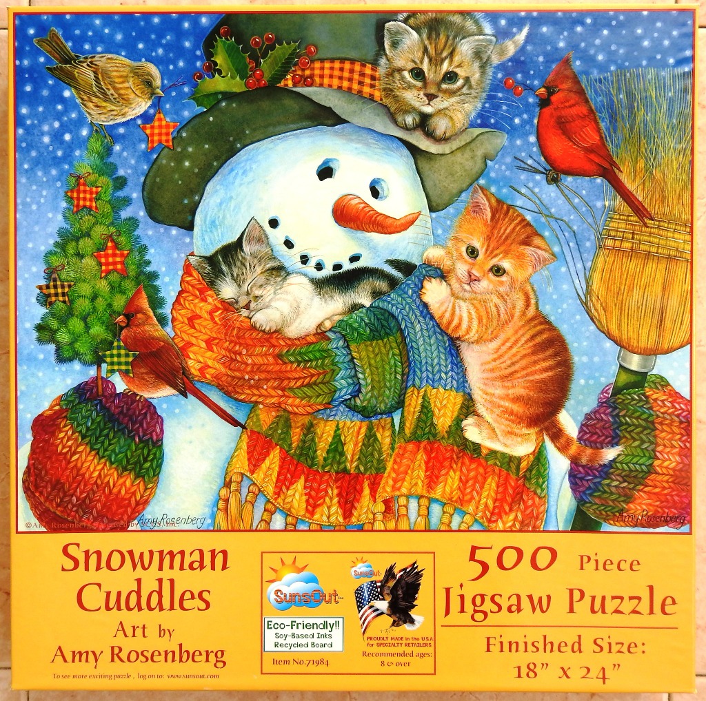 A whimsical illustration of a snowman surrounded by kittens, birds, and holiday decorations against a snowy blue sky.