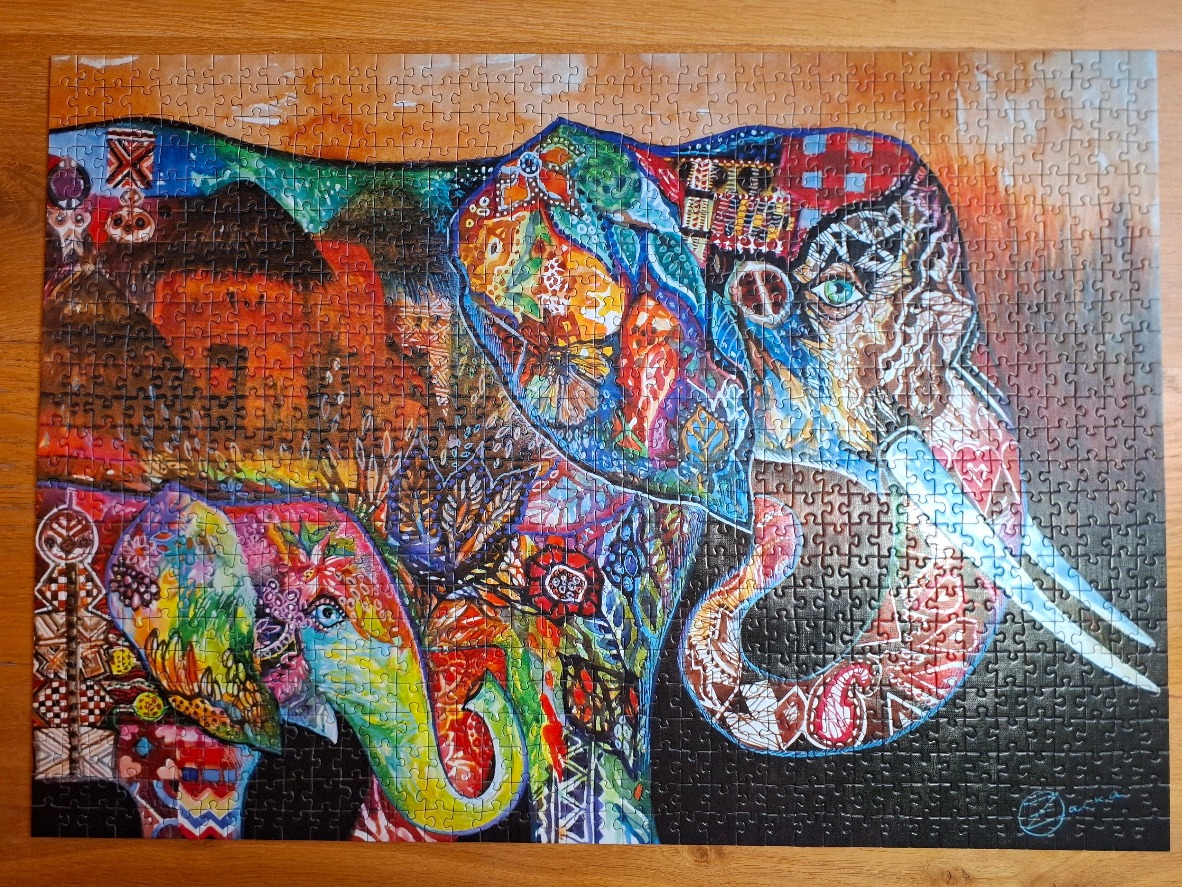 An artistic illustration of an adult elephant and its calf, decorated with intricate, colorful patterns and motifs.