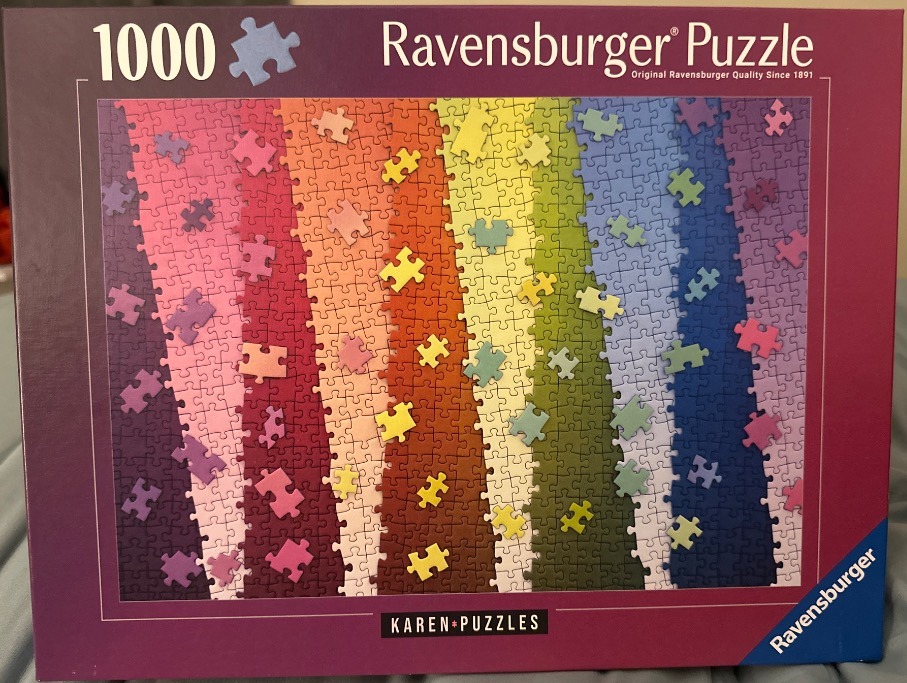 A gradient of vertical color stripes arranged in rainbow order with floating, contrasting puzzle pieces.