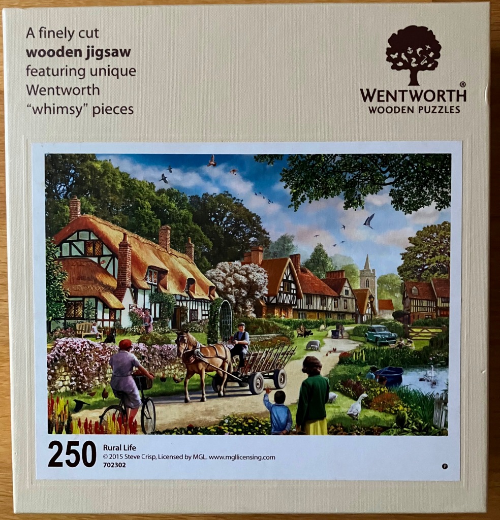 Painting of a quaint English village scene with thatched cottages, a horse-drawn cart, and villagers.