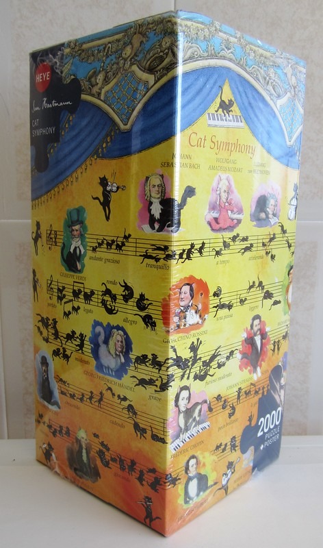 Whimsical illustration of famous classical composers with cat bodies and musical notation on a yellow background.
