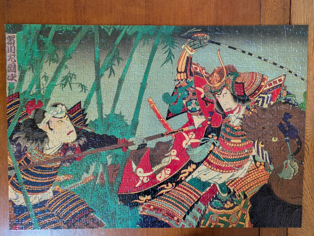 A woodblock style print of two samurai engaged in a sword fight within a bamboo grove.