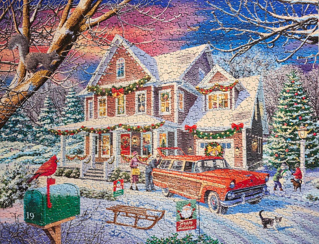 A cozy winter holiday scene with a two-story house, a wood-paneled station wagon, and a snow-covered yard.