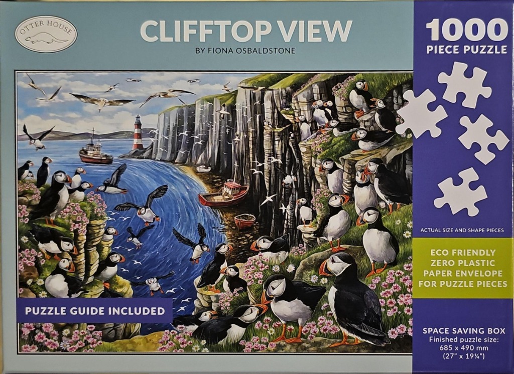 A coastal illustration featuring a large colony of Atlantic puffins on grassy cliffs overlooking a blue sea with boats.