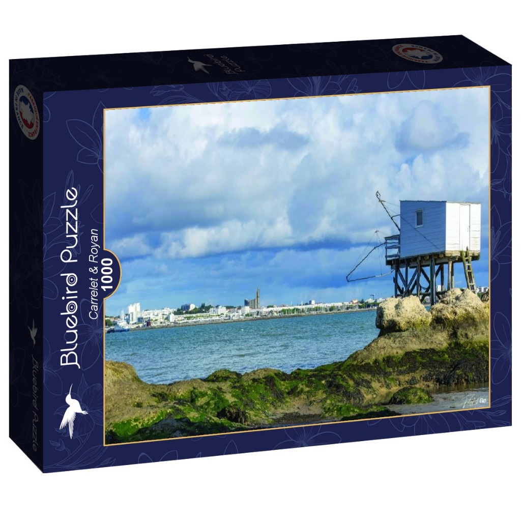 A coastal scene in Royan featuring a traditional wooden fishing hut on stilts overlooking the ocean and city skyline.