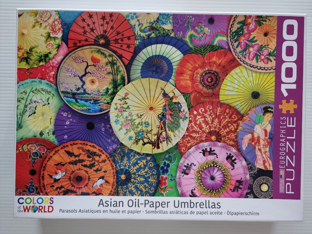 A collage of various colorful Asian oil-paper umbrellas featuring intricate patterns and designs.