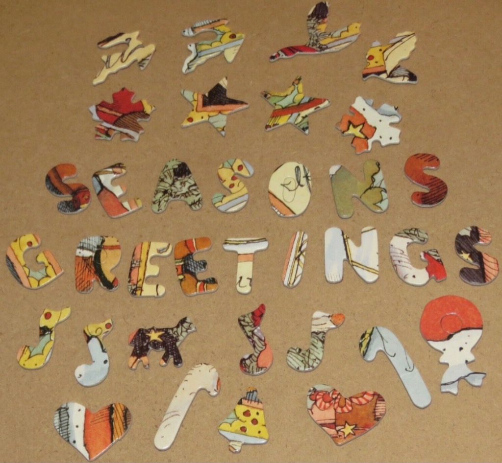 The text SEASONS GREETINGS formed by patterned letters, surrounded by holiday-themed shapes on a tan background.
