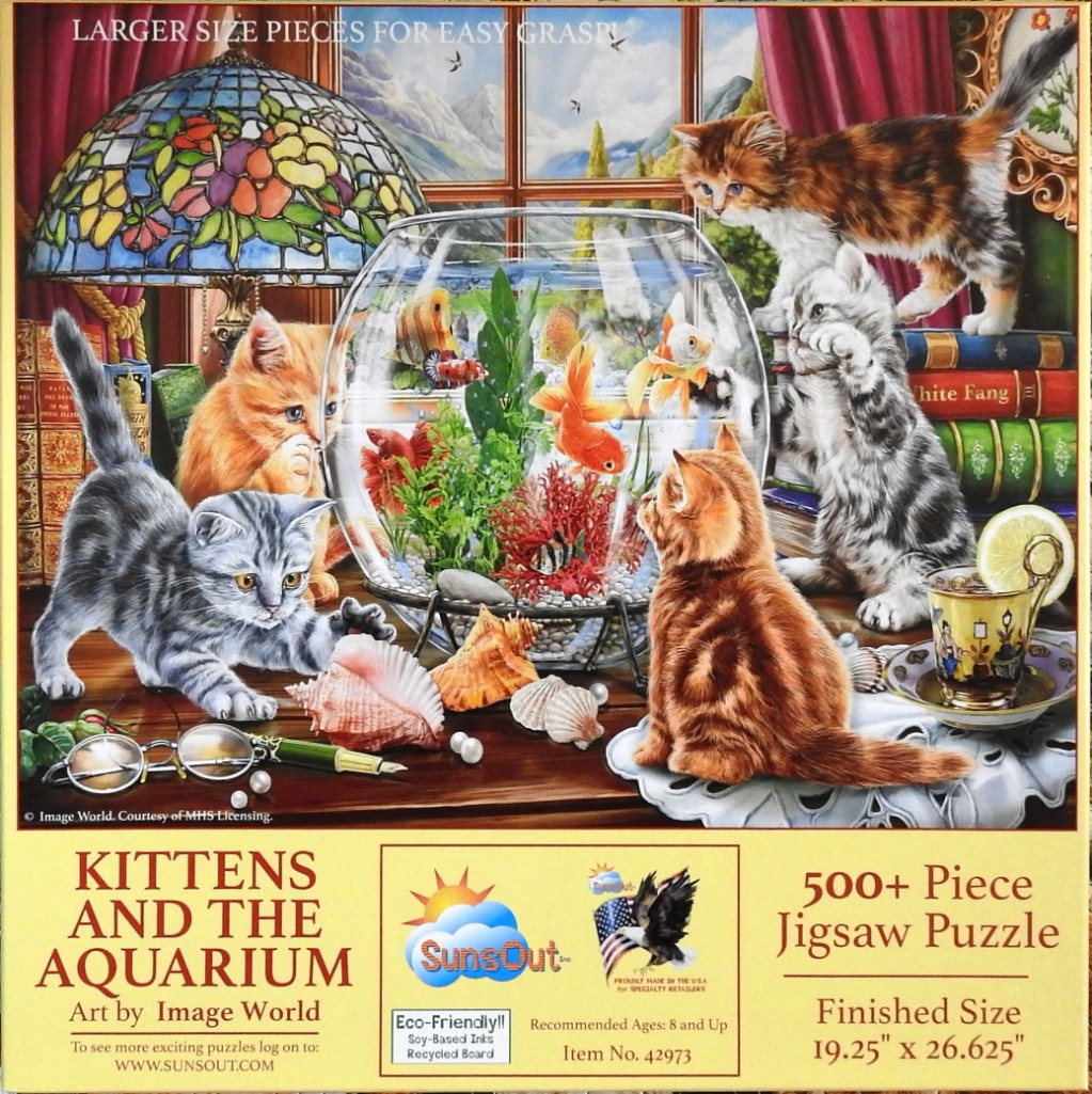 Four kittens exploring a desk with a fishbowl, a stained glass lamp, and vintage books.