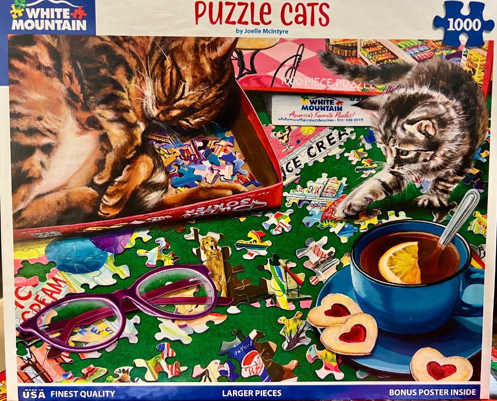 A painting of two cats interacting with puzzle pieces, a cup of tea, and glasses on a green surface.
