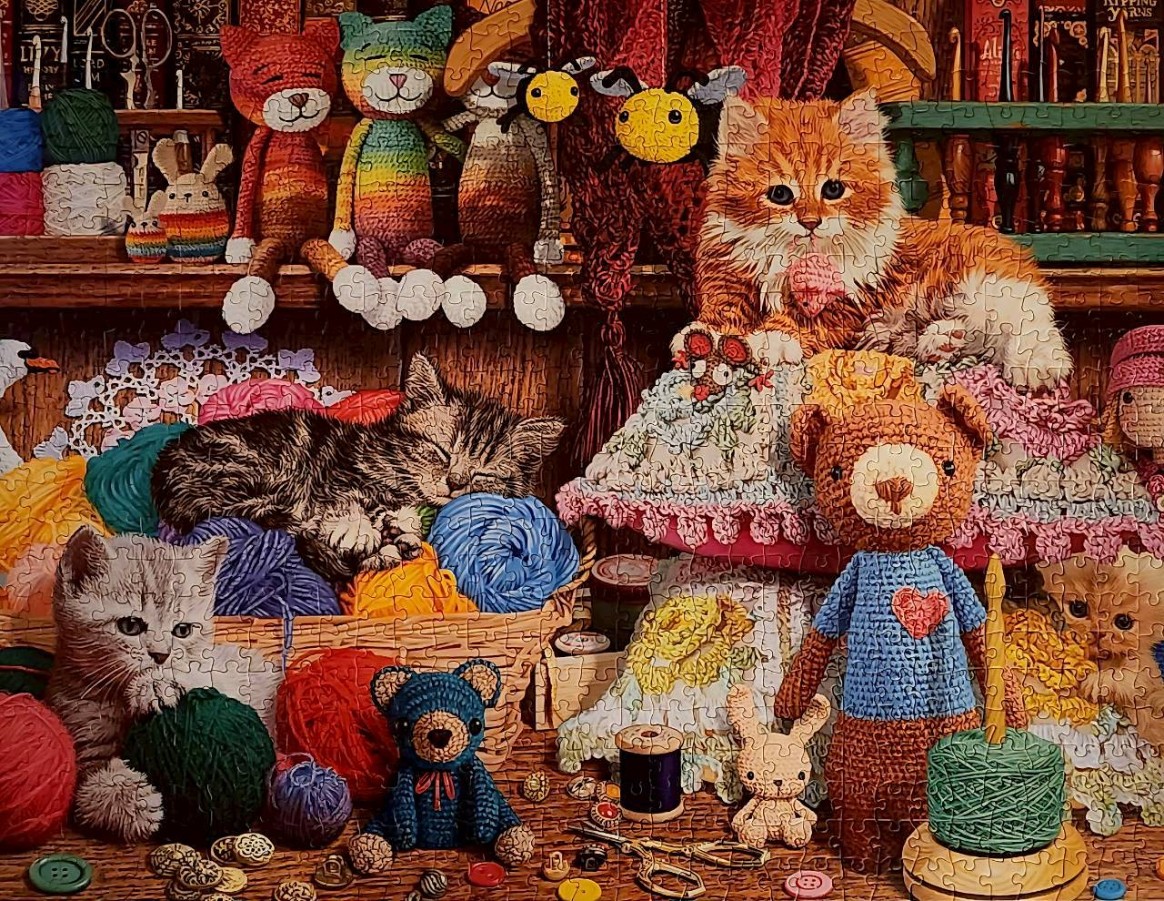 Cozy craft room filled with cats, crochet toys, and balls of yarn