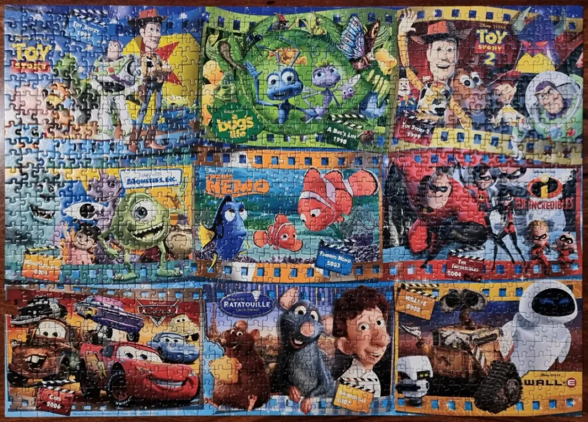 A collage of nine iconic Pixar animated films arranged in a grid with filmstrip borders.