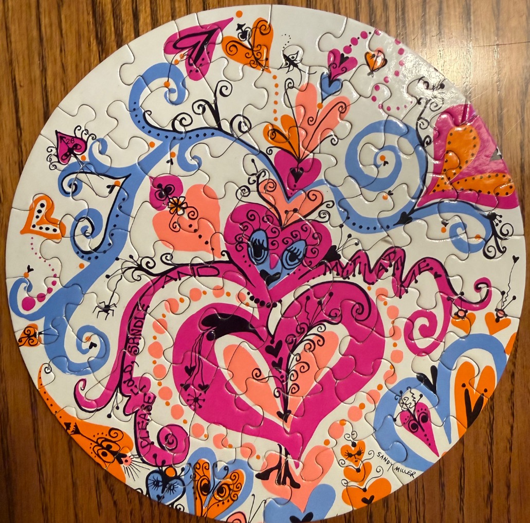 Circular illustration featuring whimsical, colorful hand-drawn hearts and swirling blue vines on a white background.