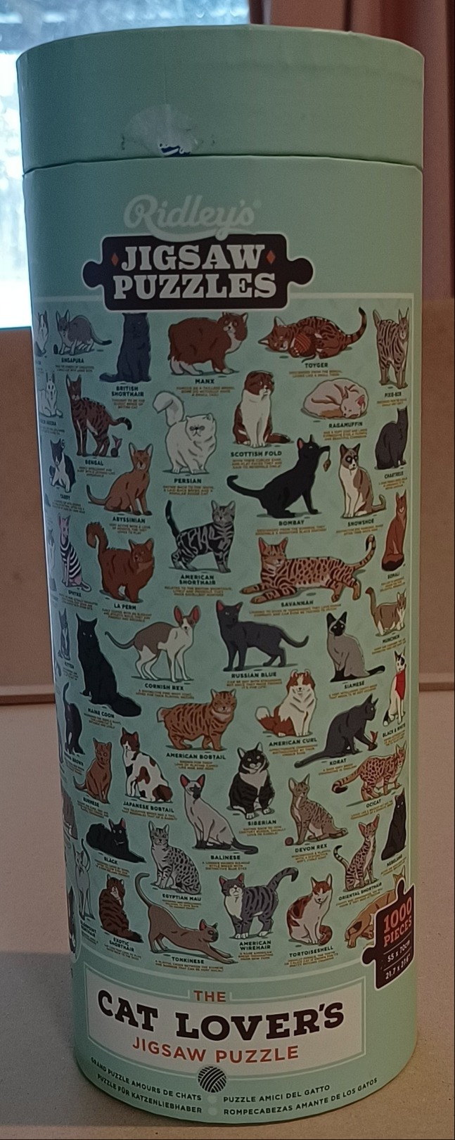 An illustrated chart featuring many different breeds of domestic cats with descriptive text below each animal.