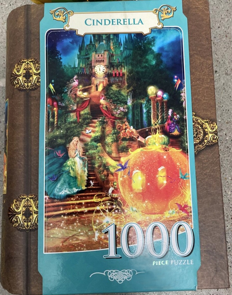 Cinderella illustration featuring a glowing pumpkin carriage, castle, and ball gown at night.