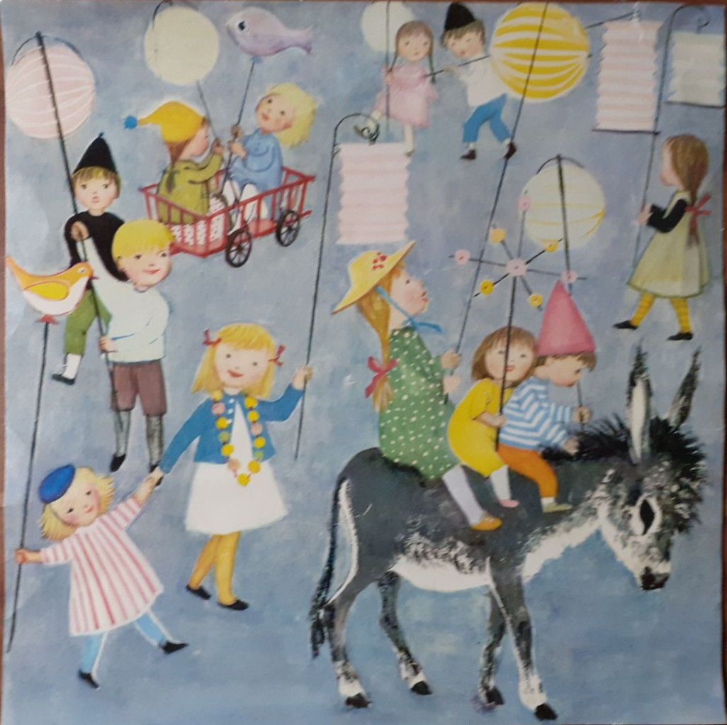 An illustration of children holding lanterns and riding a donkey in a whimsical parade against a blue background.