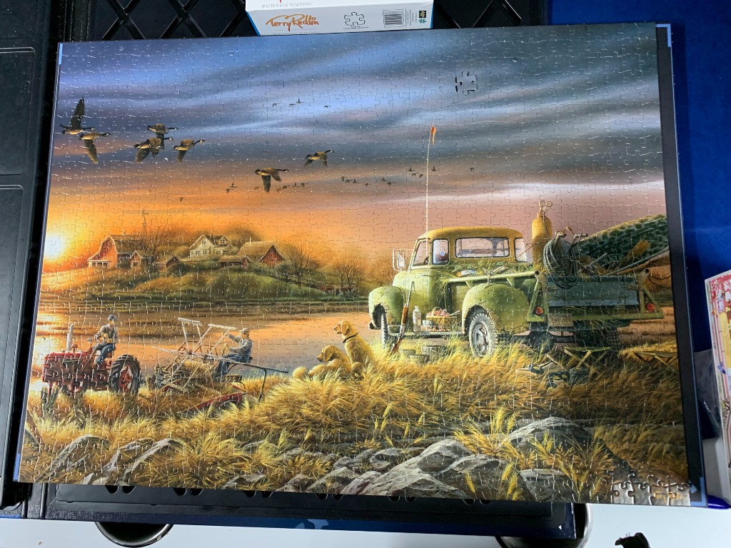A rural sunset scene with a vintage green truck, two dogs, a farmer on a tractor, and geese flying overhead.