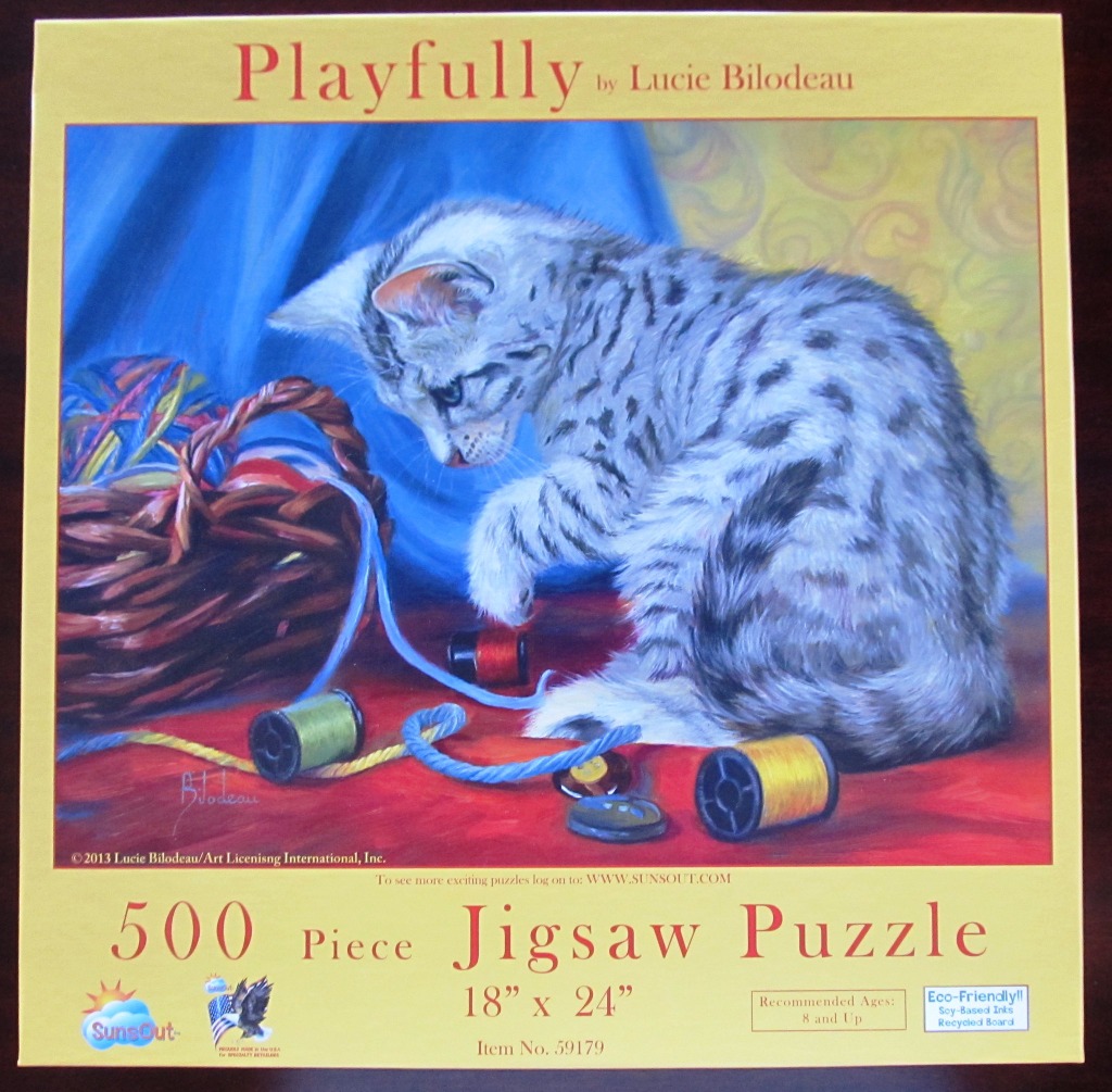 An oil painting of a silver tabby kitten playing with colorful spools of thread near a wicker basket.