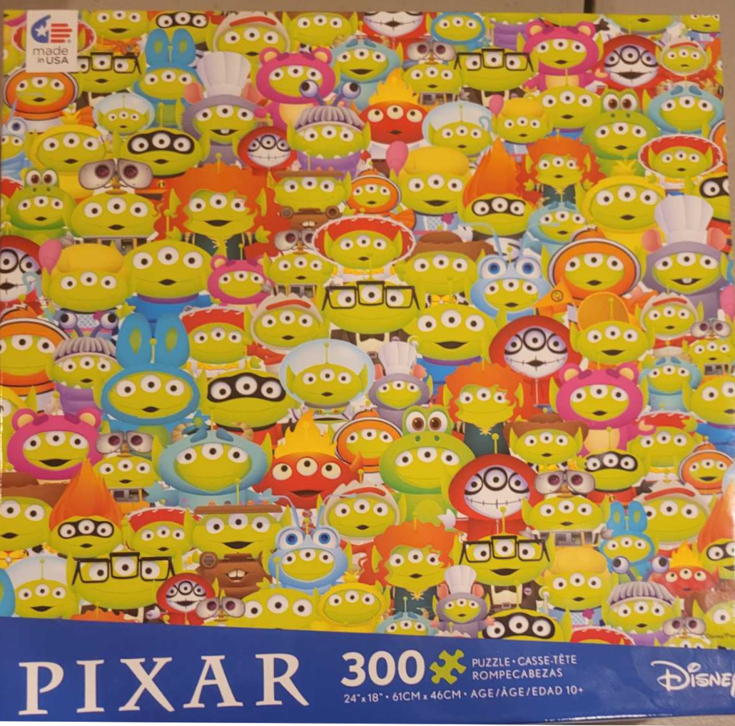 A dense pattern of lime-green three-eyed aliens from Toy Story dressed in various character costumes.