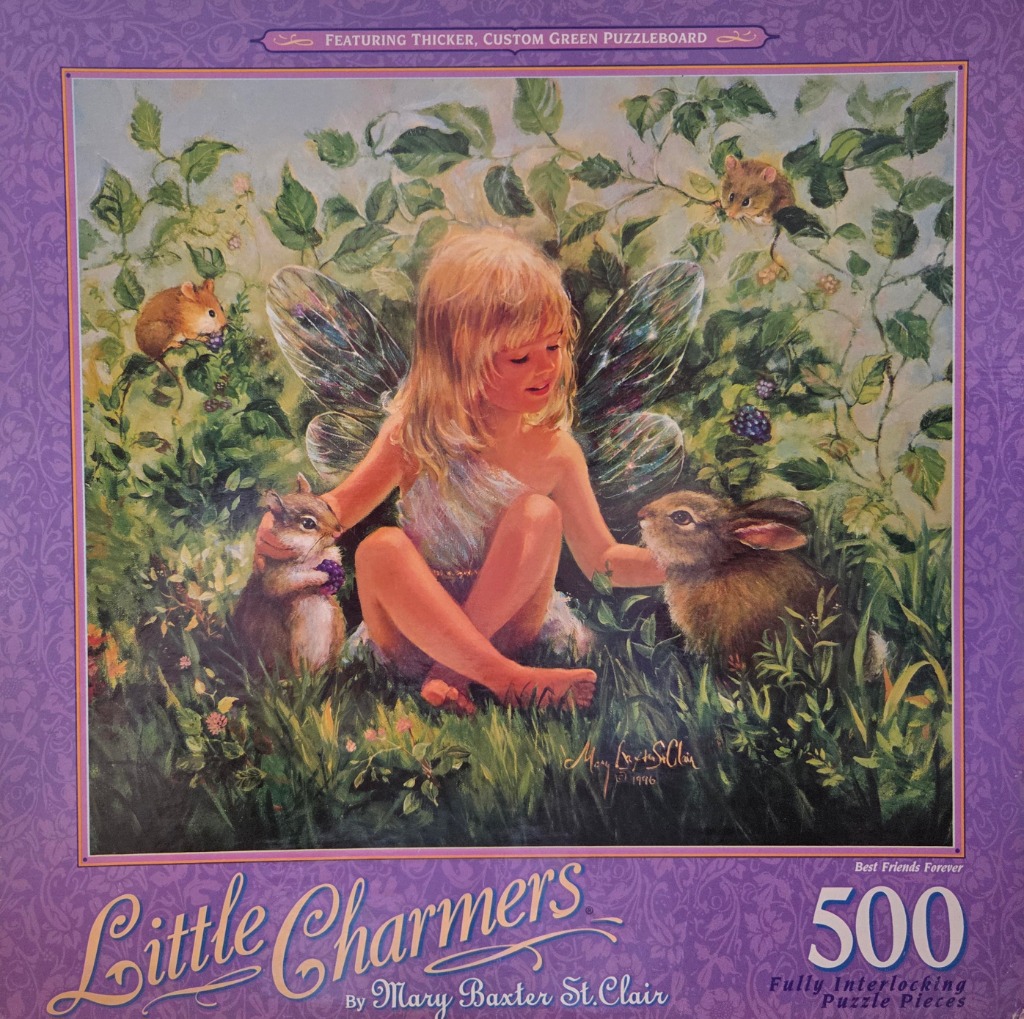 A young fairy with blonde hair and gossamer wings sits in a field surrounded by woodland animals.
