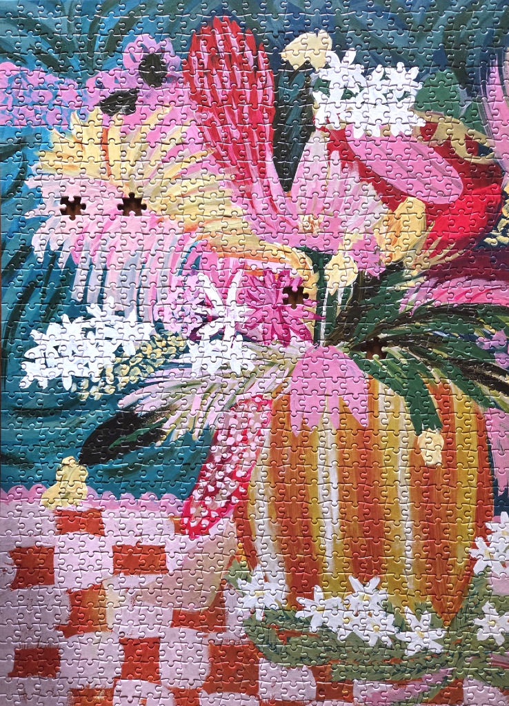 A vibrant oil painting-style floral arrangement in a striped vase on a checkered tablecloth.